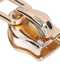 Close-up of a light gold zipper slider from the 5 Piece Zipper Sliders Set For Quick On The Go Fixes Detachable Reusable Zipper Pulls Replacement Kit.