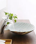 Upgrade Your Bath Game With This Killer Shell Tempered Glass Vessel Sink and Waterfall Faucet Featuring Hot Cold Rotary Mixer Tap Heavy Duty Countertop Wash Basin Smooth Durable Build, showing sink with waterfall faucet.