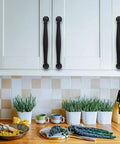 Installed 10 Pack 4 Inch Hole Center Matte Black Heavy Duty Solid Cabinet Pulls For Dressers Bathrooms Kitchens And Cabinets Durable Zinc Alloy Hardware With Premium Matte Finish on white kitchen cabinets.