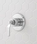 Signature Hardware Gunther 1.8 GPM Pressure Balanced Shower System chrome control valve on white hexagon tile wall.