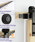 Close-up of 6 Ft Sliding Barn Door Hardware Kit With Black Track, 1 Quarter Inch Carbon Steel Rails, 265 Lb Load Capacity, J Shape Wheel System, easy installation details.