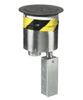 Workhorse Fire Rated Round Poke Through Electrical Plate Built Tough With Heavy Duty Cast Aluminum Slick Black Finish UL Certified 20 Amp Four Outlet Cutout, close-up of receptacle with yellow tape.