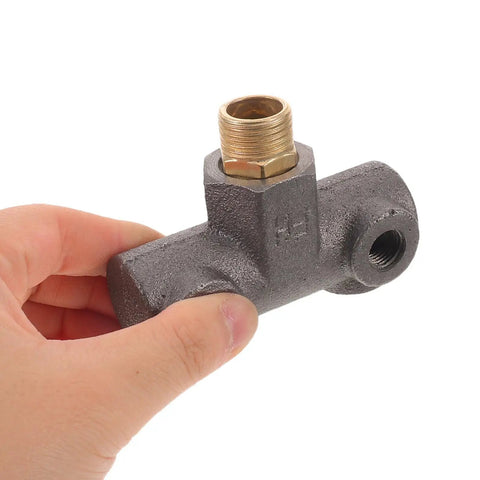Close-up of a hand holding Beefy Heavy Duty Cast Iron Air Compressor Cross Adapter with four-way design and precision threads.