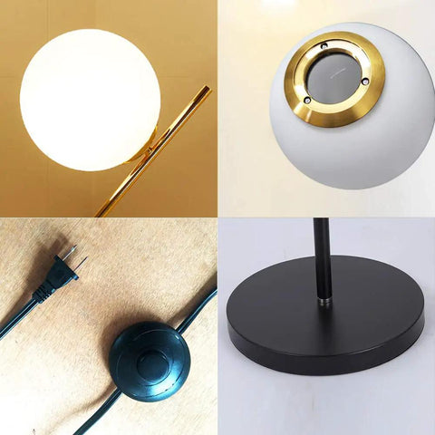 Close-up of Two Milky White Glass Orbs Brass Finish Floor Lamp With Black Base, Modern Mid Century Style details.