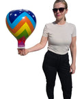 Person holding a Multicolor 18 Inch Inflatable Hot Air Balloons Set With 3 Designs 3 Pack For Kids Parties Party Favors Bright Colors