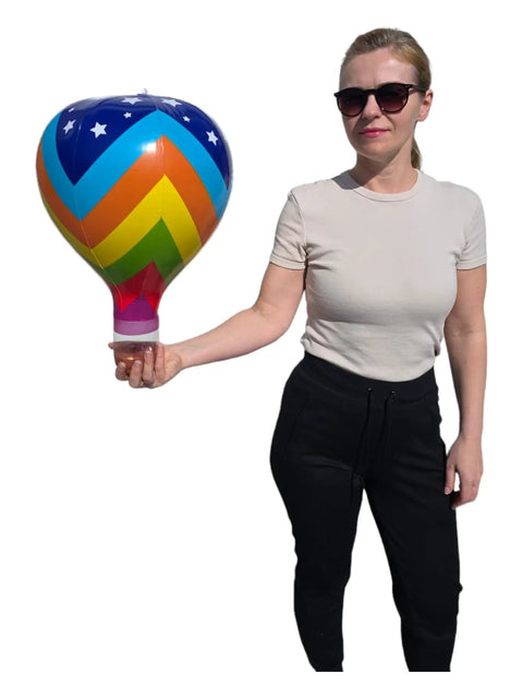 Person holding a Multicolor 18 Inch Inflatable Hot Air Balloons Set With 3 Designs 3 Pack For Kids Parties Party Favors Bright Colors