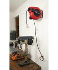 Lincoln 1220B Pro Shop Utility Reel Kit With Air Water Retractable Hose Reel 50 Ft And 60 Ft Tri Tap Power Cord Reel installed in garage