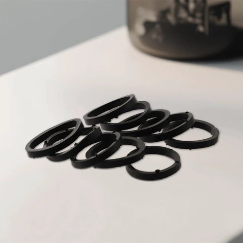 Replacement Heavy Duty Rubber Washers For Spinlock Dumbbell Nuts 1 Inch Fit 25mm O Rings scattered on surface