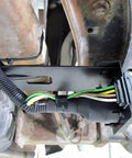 No Sweat Four Pin To Seven Pin RV Trailer Wiring Adapter With Dual Output Flat Harness and Brake Wire Circuit mounted near hitch.
