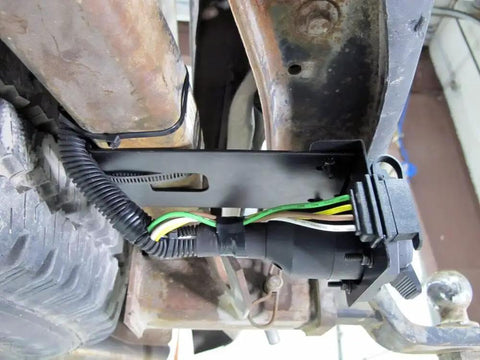 No Sweat Four Pin To Seven Pin RV Trailer Wiring Adapter With Dual Output Flat Harness and Brake Wire Circuit mounted near hitch.