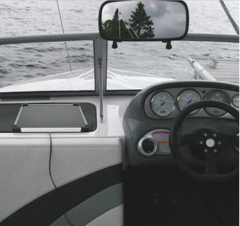 Heavy Duty Five Watt Solar Battery Trickle Charger With Overcharge Guard on boat dashboard keeping battery charged.