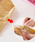 Slick Mini Portable Handheld Bag Sealer For Fresh Snack Storage And Grocery Plastic Packaging Clamps heat sealing a snack bag.
