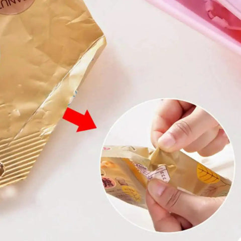 Slick Mini Portable Handheld Bag Sealer For Fresh Snack Storage And Grocery Plastic Packaging Clamps heat sealing a snack bag.