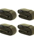 Four rolled green polyester luggage tie straps, durable for securing backpacks and suitcases, perfect for moving and camping.
