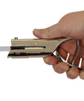 Hand holding Heavy Duty Handheld Workhorse Single Hole Punch With 1/8 Inch Punch And 2 Inch Reach in silver