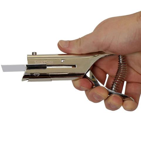 Hand holding Heavy Duty Handheld Workhorse Single Hole Punch With 1/8 Inch Punch And 2 Inch Reach in silver