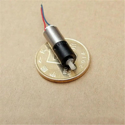 Ultra Tiny 6mm DC 3V Mini Planetary Gear Motor With 1 To 26 Gearbox 1200 RPM Coreless Drive on a coin for size comparison