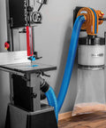 4 Inch Dust Collection Hose for Wood Shop and Shop Vac connected to dust collector and band saw, blue stretchy hose, wood shop setup.