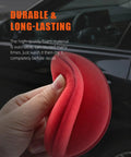 Hand holding a red foam pad from the 10 Pack Foam Wax Applicator Pads For Car Detailing, 4 Inch Red Hand Wax Pads, Soft Detailing.
