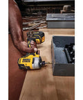 Using Atomic 20V Max Cordless Impact Driver Kit With Two Batteries And One Quarter Inch Hex Chuck on metal surface.