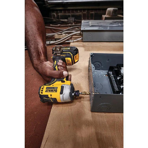 Using Atomic 20V Max Cordless Impact Driver Kit With Two Batteries And One Quarter Inch Hex Chuck on metal surface.