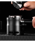 Close-up of 58mm Adjustable Portafilter Holder And Espresso Tamping Station with silicone mat, steady setup for espresso.