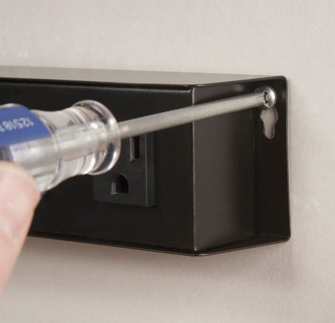 Installing six outlet metal power strip with ten foot cord built in circuit breaker protects against overloads lighted on off switch.