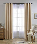 Two Panels Biscotti Beige Blackout Curtains 52 Inches By 95 Inches, Triple Weave Microfiber Grommet Top installed in room.