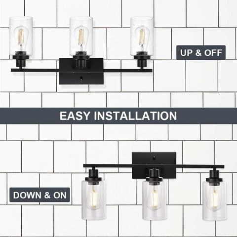 Three Light Matte Black Farmhouse Vanity Light With Seeded Glass Wall Sconce, displayed in up and down orientations on tile wall.