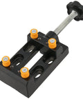 Four Piece Mini Bench Vise Clamp Set With Universal Adjustable Table Vise For Drill Press Jewelry Making Watch Repair Sculpting Projects Heavy Duty Black, top view showing orange knobs and black handle.