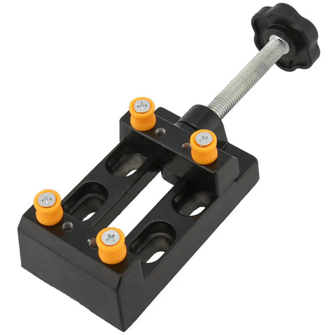 Four Piece Mini Bench Vise Clamp Set With Universal Adjustable Table Vise For Drill Press Jewelry Making Watch Repair Sculpting Projects Heavy Duty Black, top view showing orange knobs and black handle.