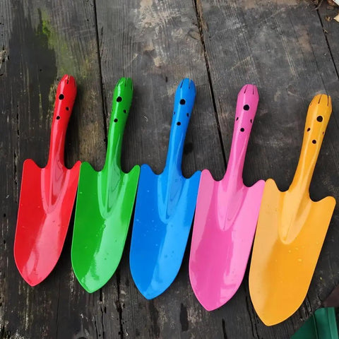 Red, green, blue, pink, and yellow mini colorful metal hand shovels set on wood, 10 pack, 11 by 3 inches durable garden trowels.