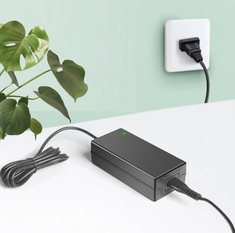 15V AC DC Power Adapter Charger For MediConsult MRS 2000 Plus Designo Home PEMF Machine plugged into wall outlet