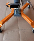 Cast Iron Transmission Jack Casters, 12mm Stem, 2.1 In Wheel Diameter, installed on orange transmission jack base