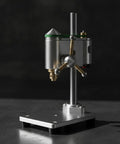 Mini bench drill press for watch repair and pcb assembly, compact silver base with precision micro drilling features.