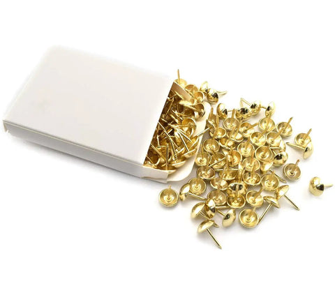 Top Shelf Gold Mushroom Upholstery Tacks For Furniture Nails And Diy Craft Projects Hella Smooth Polish With Rock Solid Iron Build Badass Accent Details 100 Piece Sweet Vibe Set in a white box with scattered tacks.