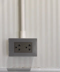 Slick Stainless Steel Outlet Faceplate With Six Hole Design For Wall Socket Mounting Hella Durable Metal Cover Easy Wipe Clean Finish, installed.