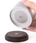 Slick Swivel Coffee Filter Paper Holder And Brewing Tool Caddy showing silver base with dark wood platform for organizing gear.