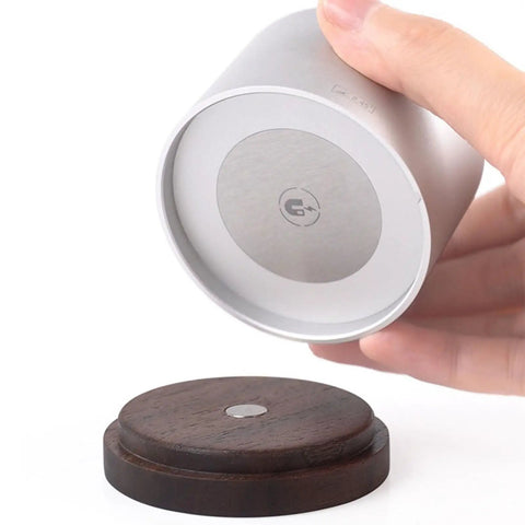 Slick Swivel Coffee Filter Paper Holder And Brewing Tool Caddy showing silver base with dark wood platform for organizing gear.