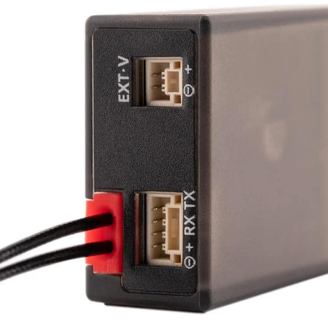 Close-up of ExpressLRS ER8 2.4GHz 8 Channel PWM Receiver With Telemetry For FPV Drones Airplanes And Gliders, showing ports.