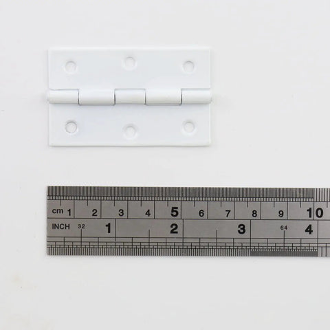Heavy Duty White Iron Folding Butt Hinges 2.5 Inch with zero play action and measuring tape for size reference.