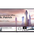 Massive 98 Inch 4K UHD LCD Display Panel Featuring Epic 60Hz Refresh Rate And Heavy Duty Commercial Digital Signage Screen Built Different For Quick Hook Up displaying a welcome message in an office setting.