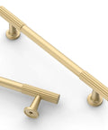 Close-up of 10 Pack 5 Inch Brushed Gold Cabinet Pulls For Kitchen Cabinets And Cupboards, Durable Metal Handles For Doors And Drawers.