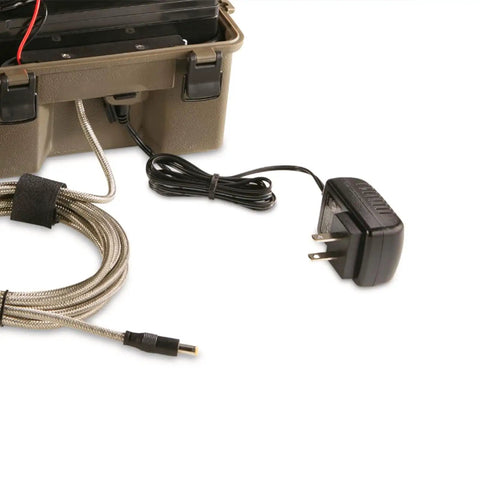 Rugged 12 Volt Battery Box For Trail Cameras with charger cord, sealed case, and protective strap for outdoor use.