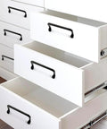 Matte Black 4 Inch Cabinet Pulls 4 Pack With Screws Modern Iron Drawer Handles on white drawers in a kitchen setting