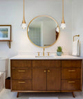 Bathroom with two Teardrop Crystal Pendant Lights With Gold Brushed Brass Finish One Light Mini LED Fixture for chic decor.