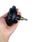Vanlison 4WD vacuum actuator held in hand; black plastic body with metal shaft and brass fitting