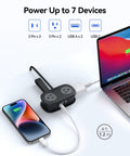 Compact Travel Power Strip With Four AC Outlets And A Four Foot Wrap Around Cord Perfect For Cruises RV Trips Or Vacations connected to a phone and laptop.