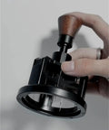 Premium Game Changer 58Mm Espresso Coffee Distributor With Magnetic Base and Precision Rotary Needles in hand.