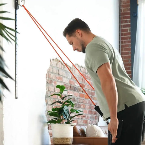 Space Saving Wall Mount Gym Anchor System With 4 Stackable Resistance Bands Adjustable Rail Car for full body workouts in a home gym.